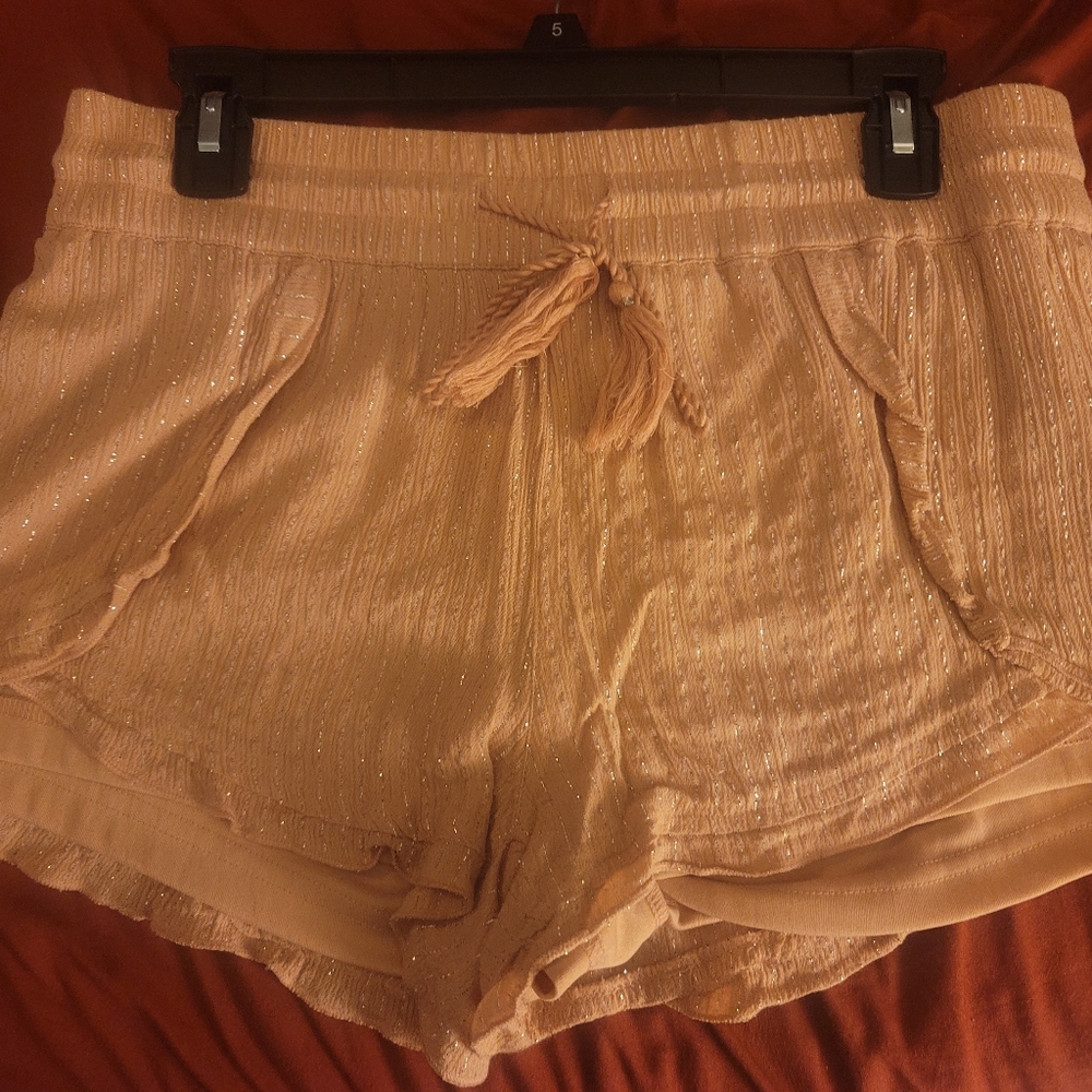 Pink with silver strips shorts.
